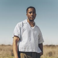 https://bricartsmedia.org/wp-content/uploads/2026/07/BraxtonCook_MCU_stripes-credit-Ricardo-Nagaoka.jpg